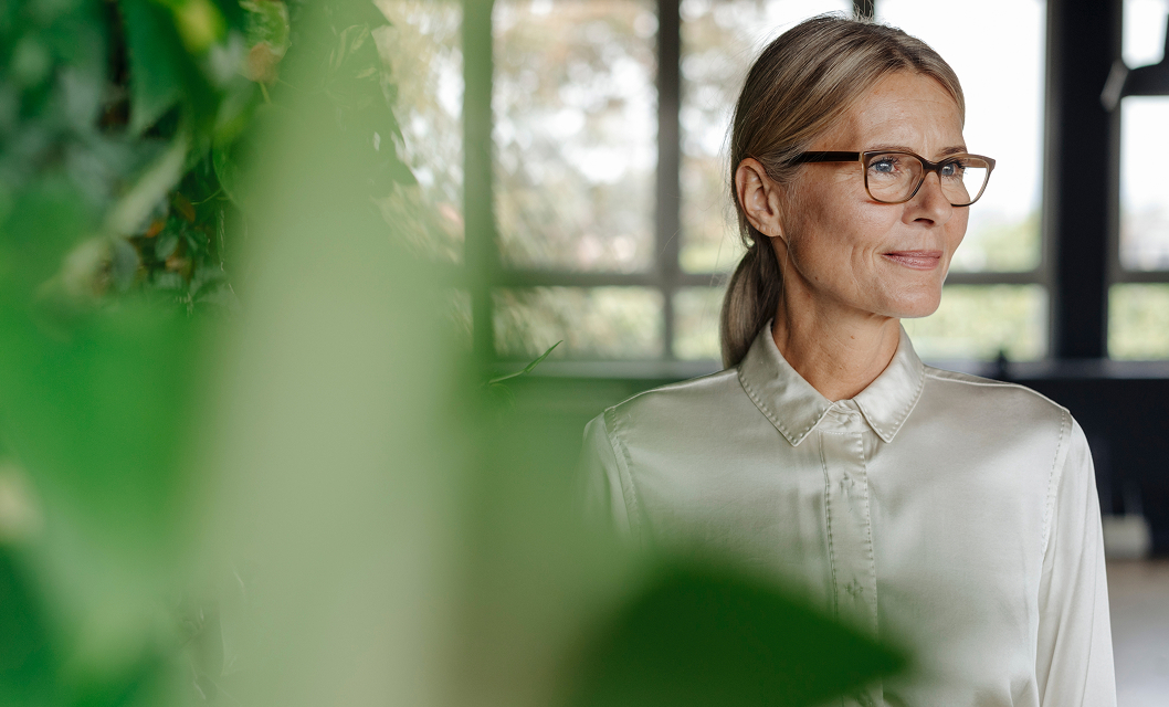 man inspects goof off packaging on the production line.